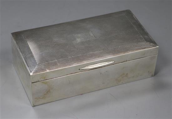 An engine turned silver cigarette box, 16.5cm.